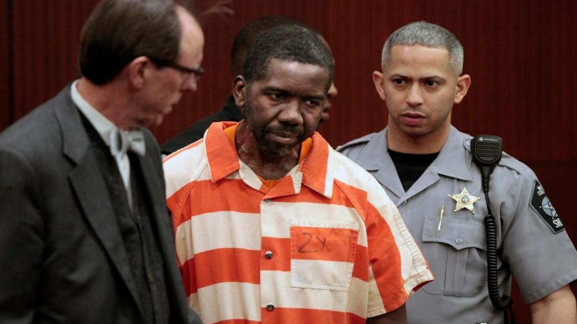 Murder defendant Elhadji Seydou Diop, center, enters a Wake County Superior Court in 2016.