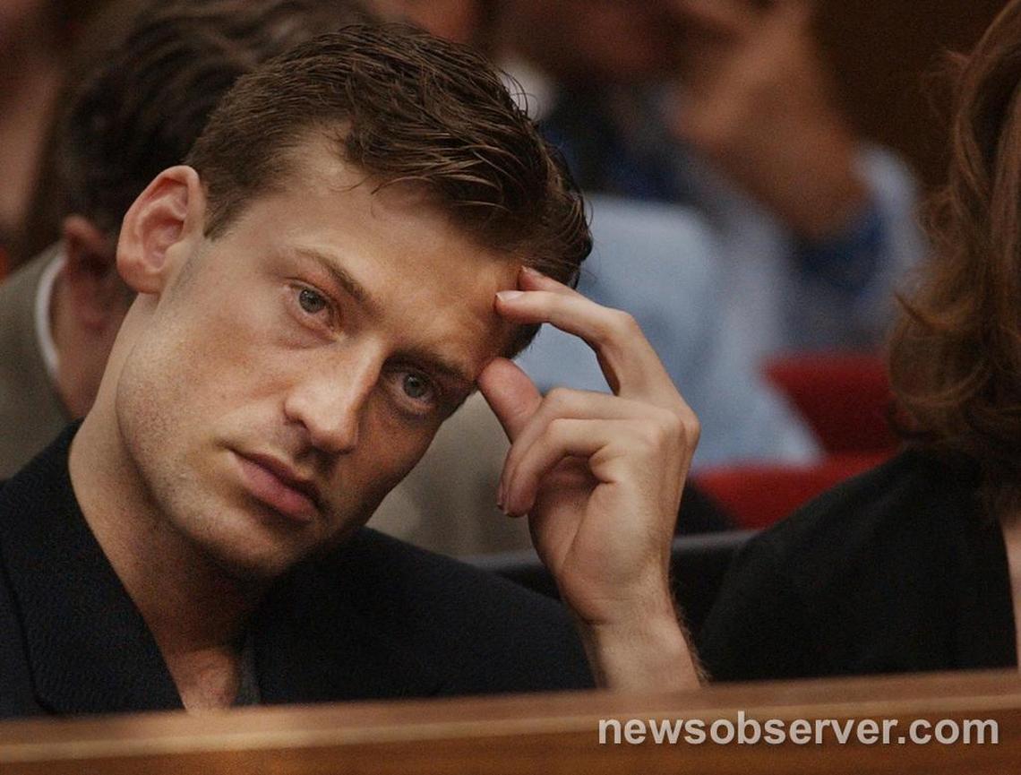 Todd Peterson listens as former Durham police officer James McVay describes his attitude the night his step mother was found dead in the Peterson home during testimony July 11, 2003 in his father Michael Peterson’s murder trial.
