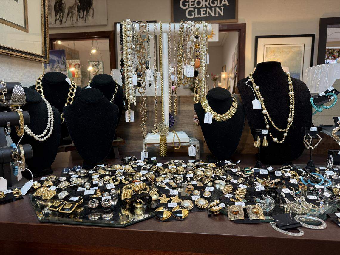 Earrings and necklaces for sale are arranged at The Perfect Piece, a store in downtown Cary.