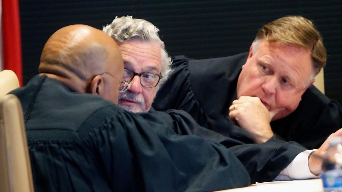 A three-judge panel of L. Todd Burke, left, Jesse Caldwell, center, and Jeffrey Foster issued a ruling on Monday, March 5, 2018, striking down part of a 2017 law that created a merged 8-member elections and ethics board.