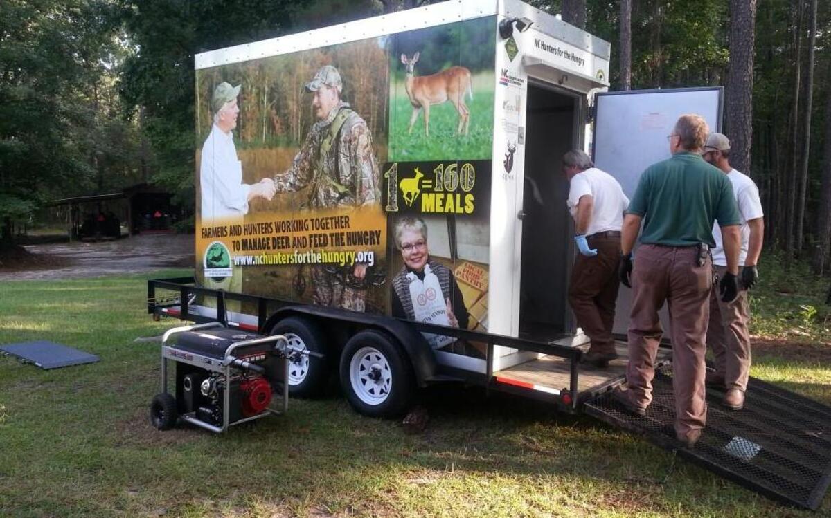 Wrapped in graphics promoting its purpose, the N.C. Wildlife Resources Commission’s mobile walk-in cooler can be delivered to hunt sites and serve as a drop-off station for hunters to donate deer. Deer are transported to a processor, and the venison is ground, packaged and donated to nonprofits that feed people in need.