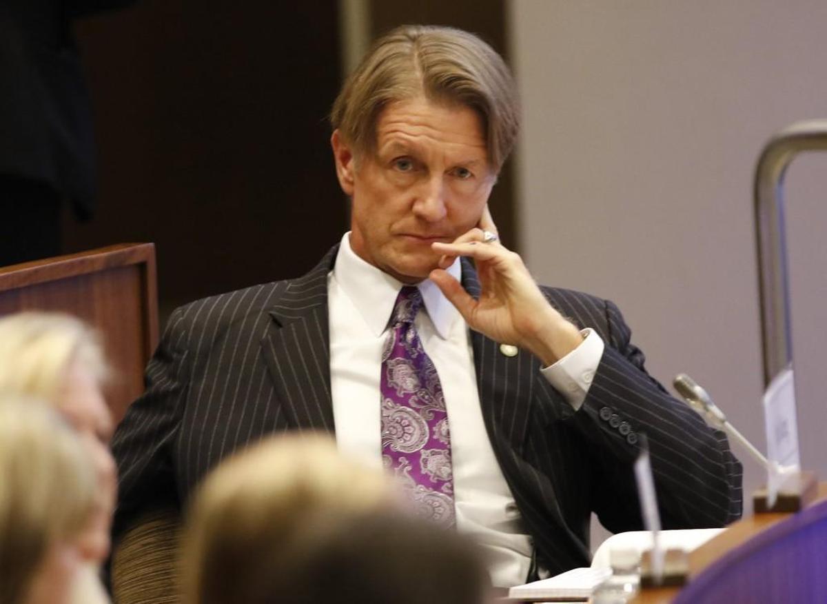 UNC Board of Governors member Thom Goolsby waits and watches with other members before the start of an emergency meeting of the UNC Board of Governors on the SAS campus in Cary.