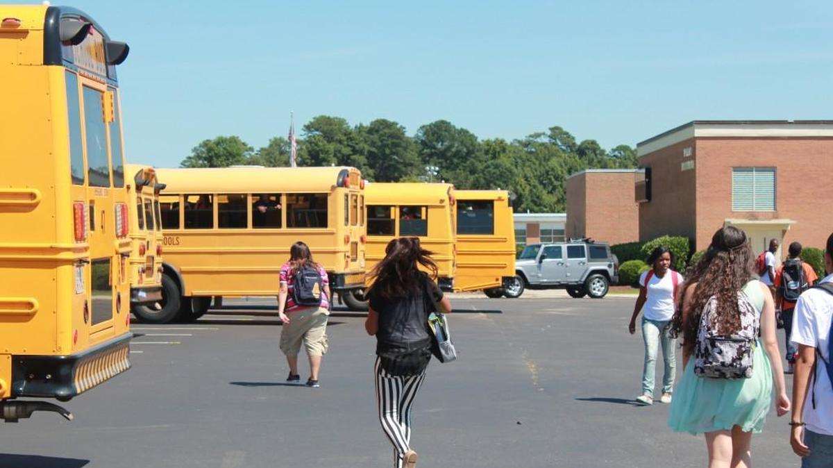 In this photo from 2013, Smithfield-Selma High School students head to their buses.