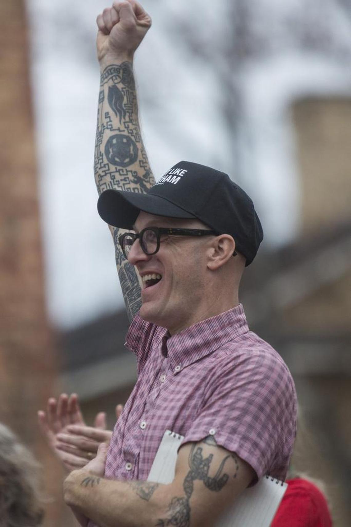 Dwayne Dixon, a teaching assistant professor in the Department of Asian Studies at UNC-Chapel Hill, cheers during a counter-protest Wednesday, February 21, 2018 at the school after university officials warned of possible trouble on campus as rumors swirled of a white nationalist rally planned for Wednesday. Dixon was in the news last summer and faced a misdemeanor charge for bringing a semi-automatic rifle to a KKK counterprotest in Durham. The charge was dismissed by a judge earlier this month.