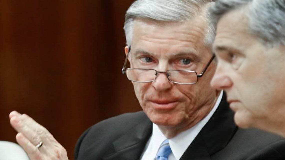 UNC system president Tom Ross, left, confers with UNC Board of Governors then-chairman John Fennebresque (cq) during the early minutes of the regular UNC Board of Governors meeting Friday, Jan. 16, 2015. Ross was forced out of his job as system president by the Board and will work to January 3, 2016 or until his successor is chosen.