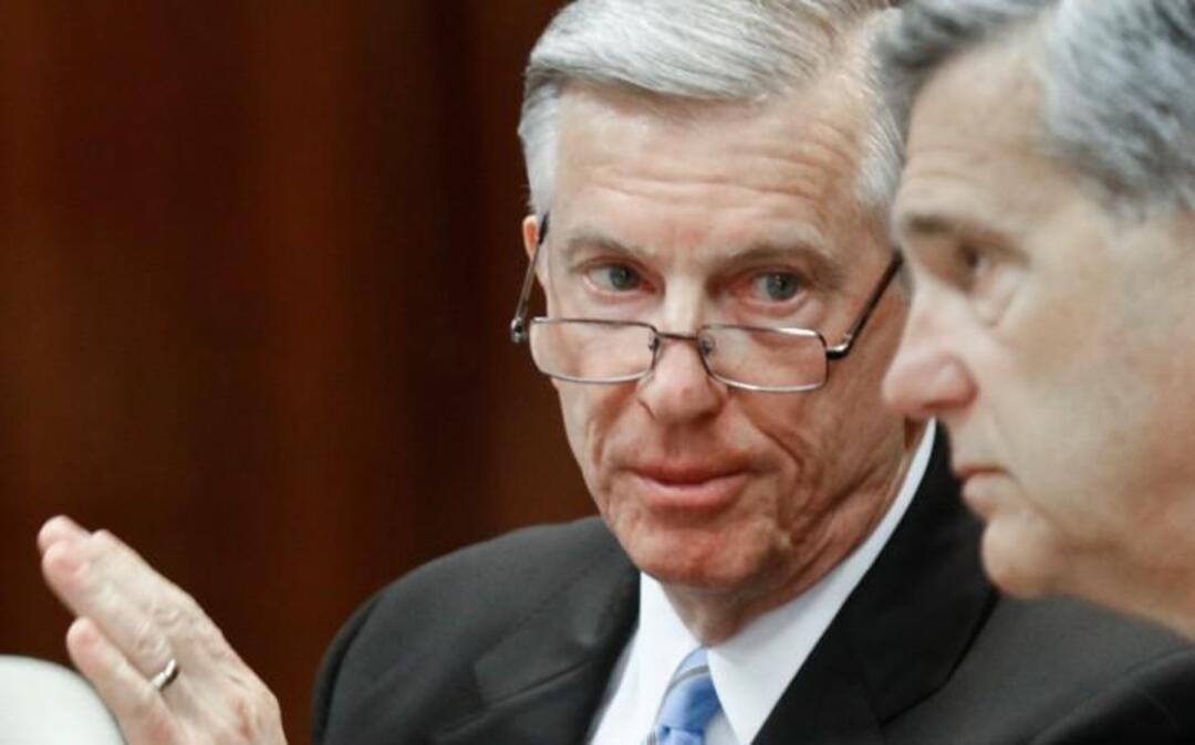 UNC system president Tom Ross, left, confers with UNC Board of Governors then-chairman John Fennebresque (cq) during the early minutes of the regular UNC Board of Governors meeting Friday, Jan. 16, 2015. Ross was forced out of his job as system president by the Board and will work to January 3, 2016 or until his successor is chosen.