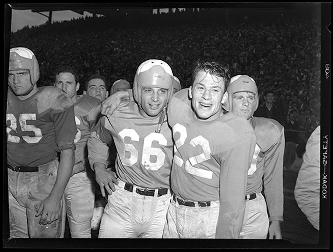 Paul Rizzo (66) celebrated with Charlie Justice (22) when they both played for the UNC Tar Heels during the 1949 season. Justice often said he was embarrassed his teammates didn’t get more credit for his success.