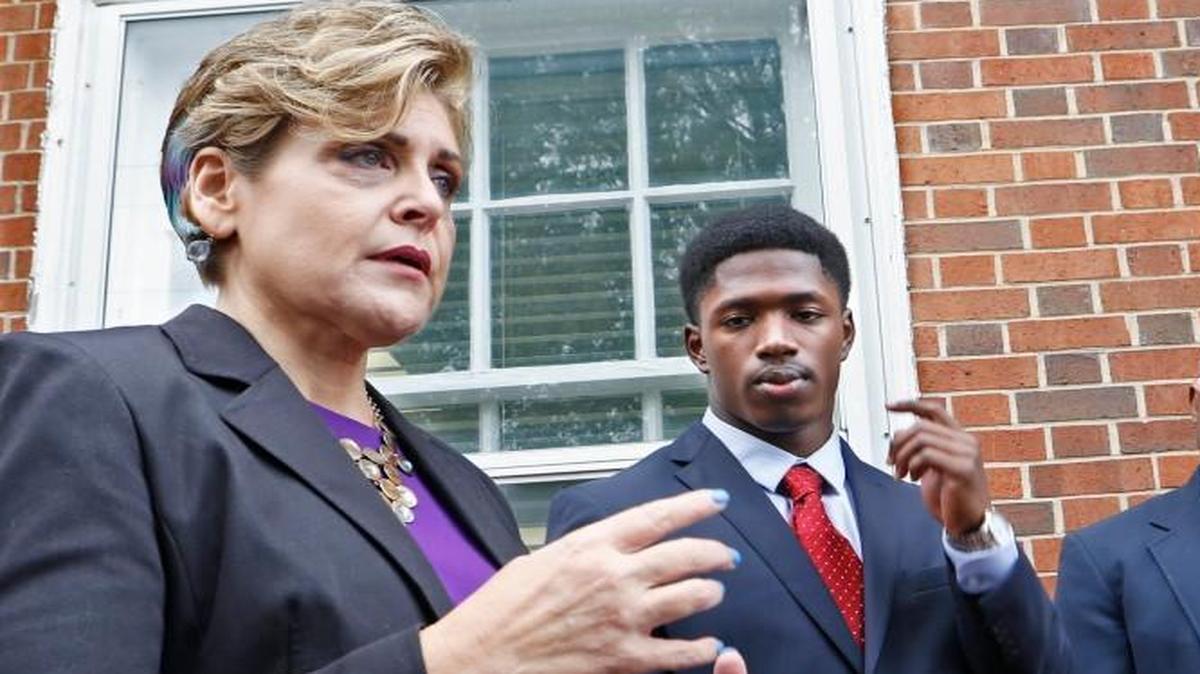Kerry Sutton, left, attorney for Allen Artis, second from left, said her client plans to plead not guilty and ‘clear his name.’