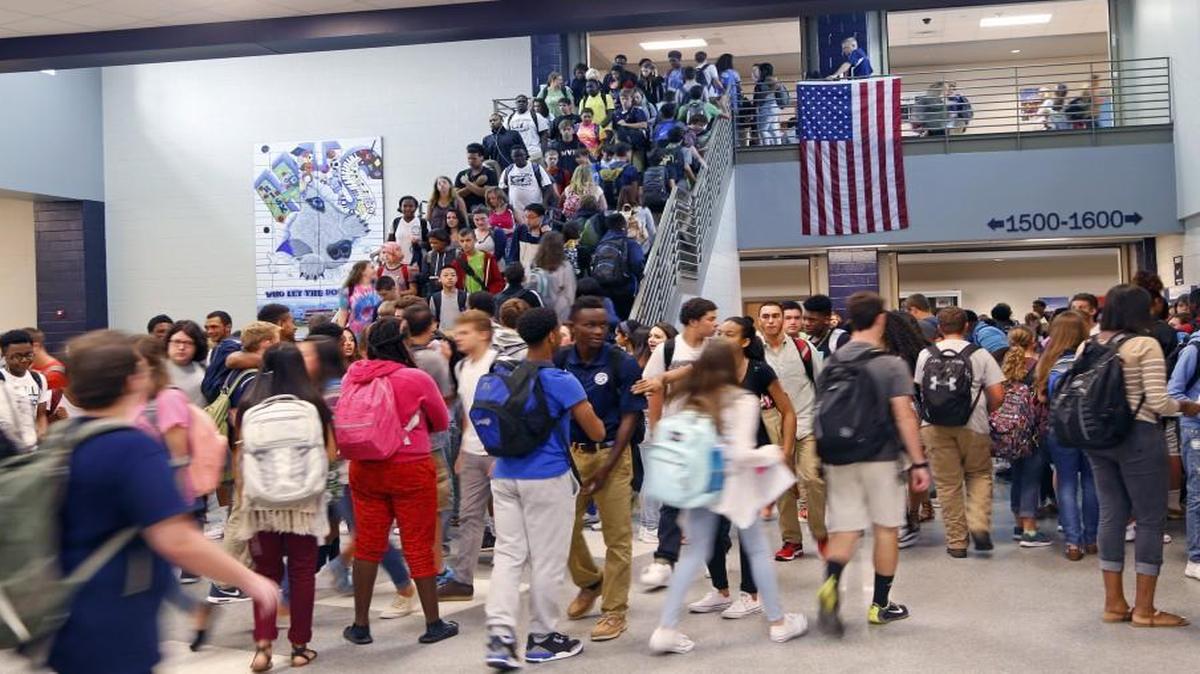 Students crowd a stairway as classes change at Heritage High School in Wake Forest. The Wake County school system has now become the 15th largest school district in the nation and the 13th largest in the continental United States.