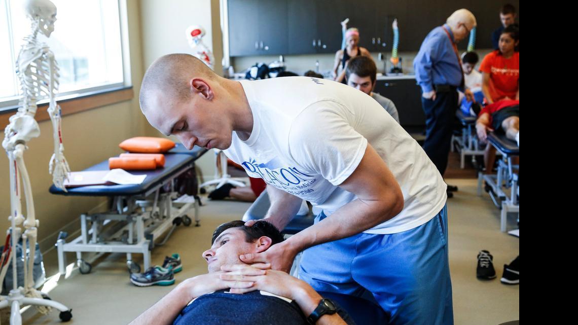 
Nathan Craig, standing, and Brad Christoph take part in a recent osteopathic class at Campbell University's medical campus in Buies Creek. Campbell established a medical school in 2013 and announced the addition of nursing and engineering schools next year. 
