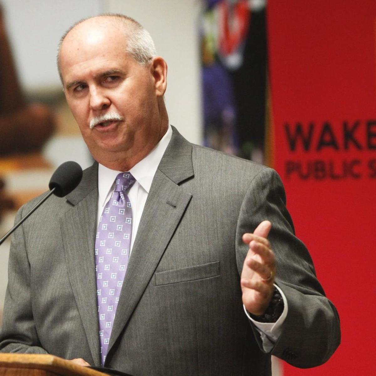 Jim Merrill, former superintendent of Wake County schools, speaks with reporters Aug. 1, 2013.