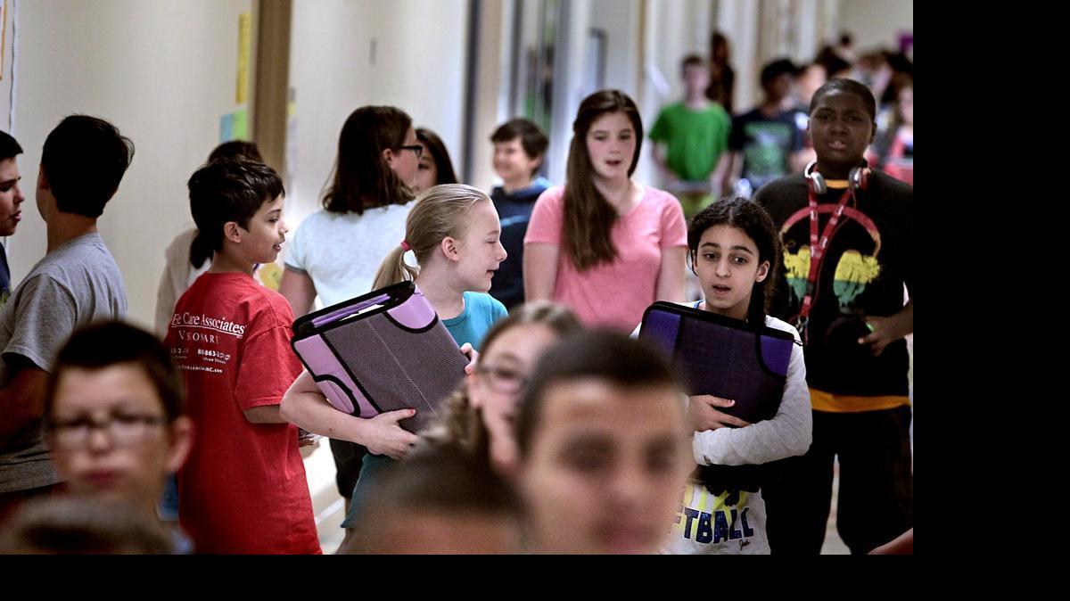 
Mills Park Middle School sixth graders move through the hallways between periods in Cary, N.C. on May 19, 2015. 
