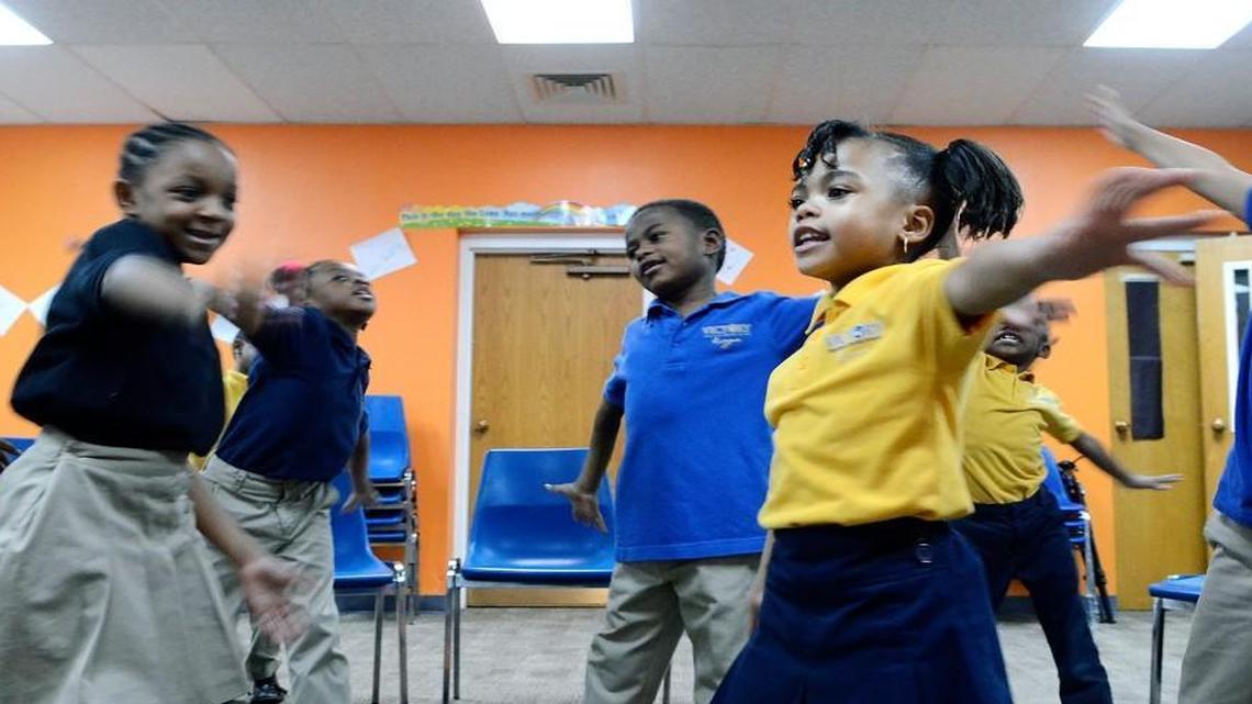 Nariah Hunter (center right), 7, dances with classmates as they sing in music class on March 15, 2016. North Carolina's Opportunity Scholarship program is making it possible for Janet Nunn's 7-year-old granddaughter, Nariah Hunter, to attend Victory Christian Center School.