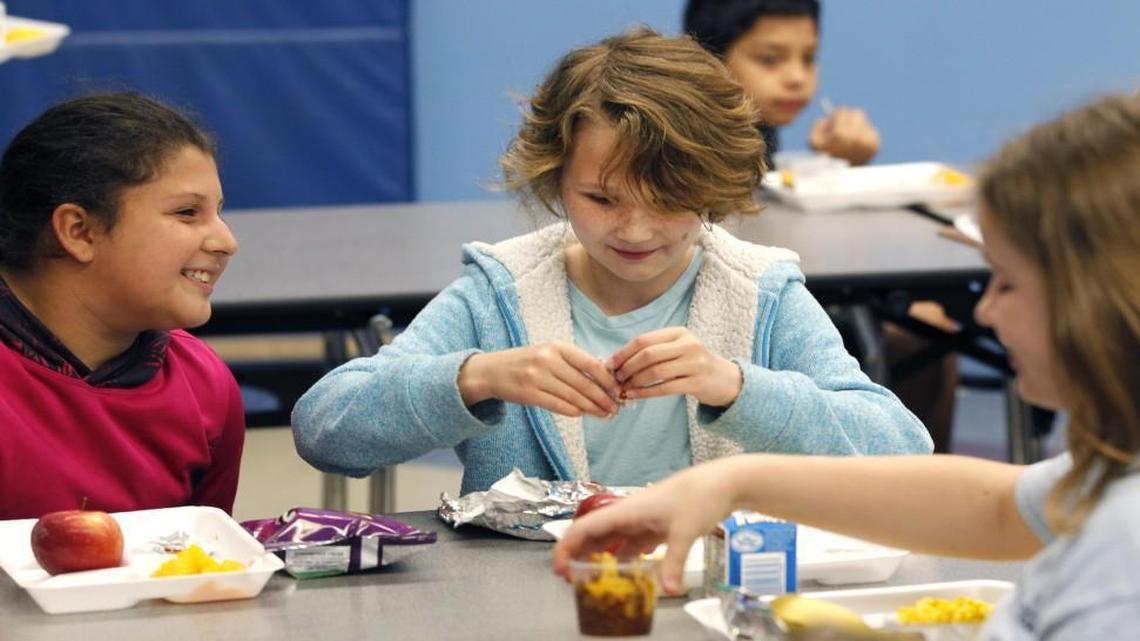 From left, fourth graders Kendall White, Mackenzie Stutts, and Lana Hart have lunch together at Partnership Elementary School in Raleigh, N.C., Thursday, April 21, 2016.