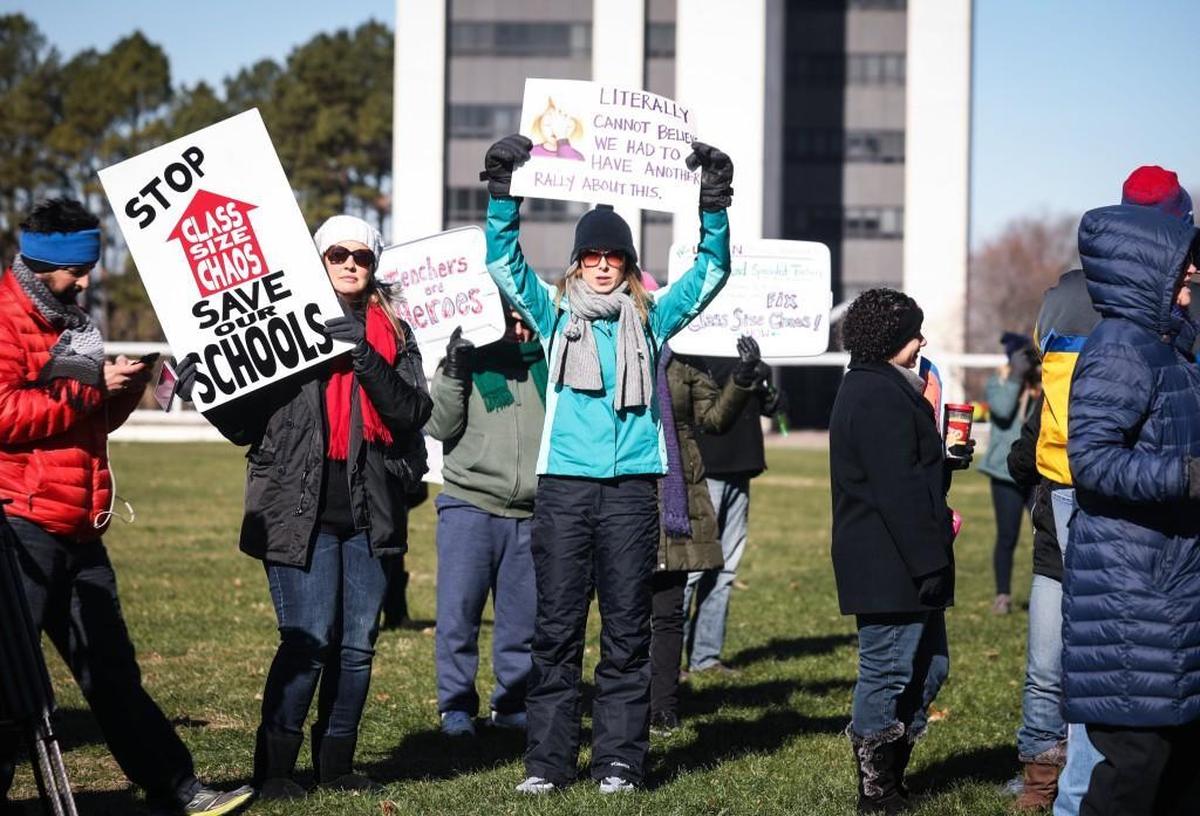 Hundreds of parents, educators and students held signs, chanted, and listened speakers during a “class size chaos” rally in downtown Raleigh on Jan. 6, 2017.