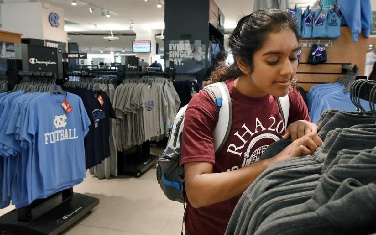 
 Freshman Smirti Singh looks through fleece sweatshirts Friday at the Daniels Student Stores  on the UNC-Chapel Hill campus.


