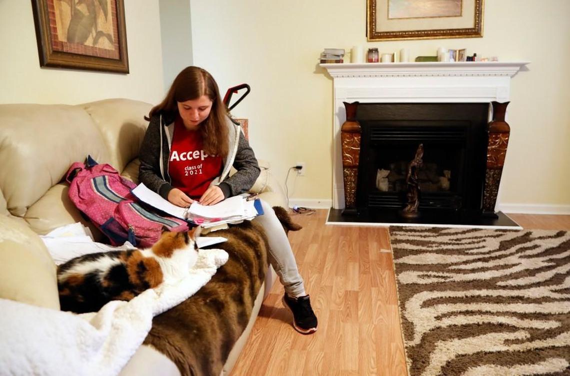 East Wake High School senior Megan Faircloth goes through some of her school papers at her home in Wendell on June 5.