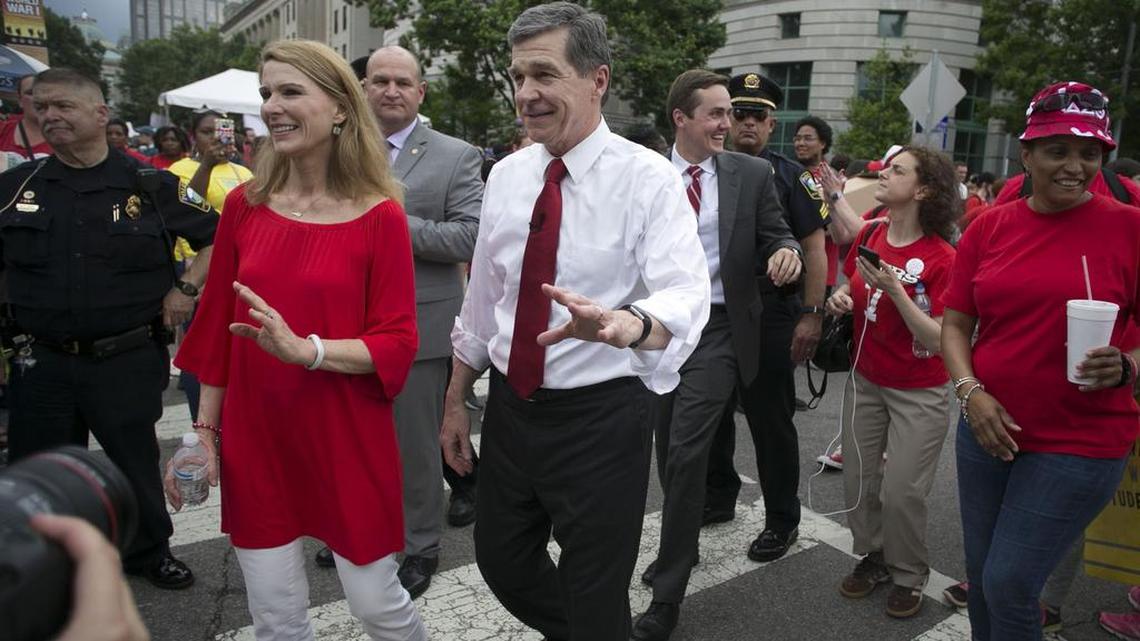 North Carolina Governor Roy Cooper and his wife Kristin Cooper greet teachers after addressing their rally on the Bicentennial Mall on Wednesday, May 16, 2018 in Raleigh, N.C.