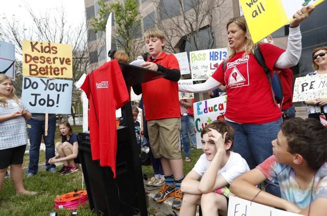 Stone Hensley, 10, a fifth-grader at Sycamore Creek Elementary School, speaks during a rally on April 19, 2017 at Halifax Mall in Raleigh, urging the NC Senate to pass House Bill 13 to give school districts relief from smaller K-3 class sizes. Hensley’s mother, Sheila Hensley, stands to the right.