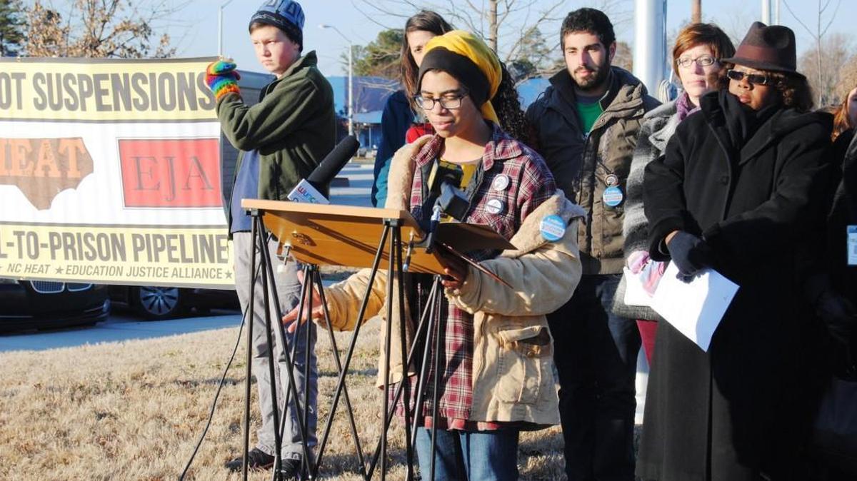 Protesters talk about the state of Wake County school discipline at an event outside East Wake High School in Wendell in this 2014 file photo.