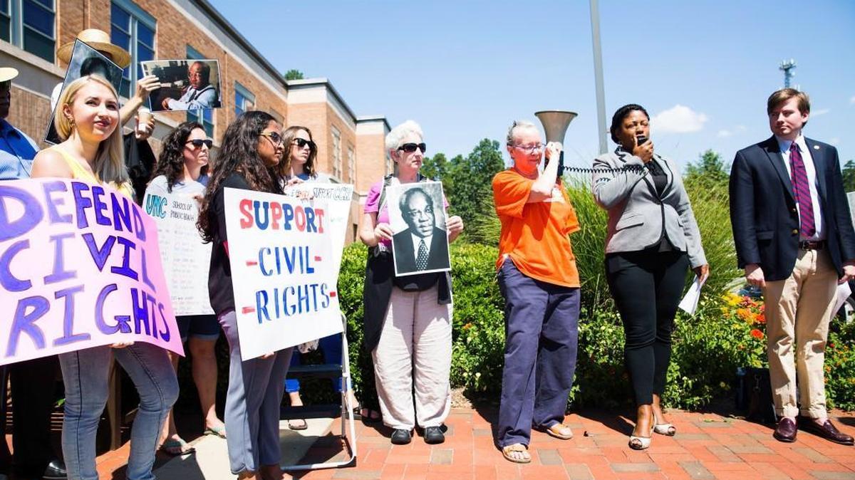 Protestors stand outside The Center for Leadership Development in support of the UNC Civil Rights Center before a committee debate determining the center's future on Aug. 1, 2017, in Chapel Hill, NC.