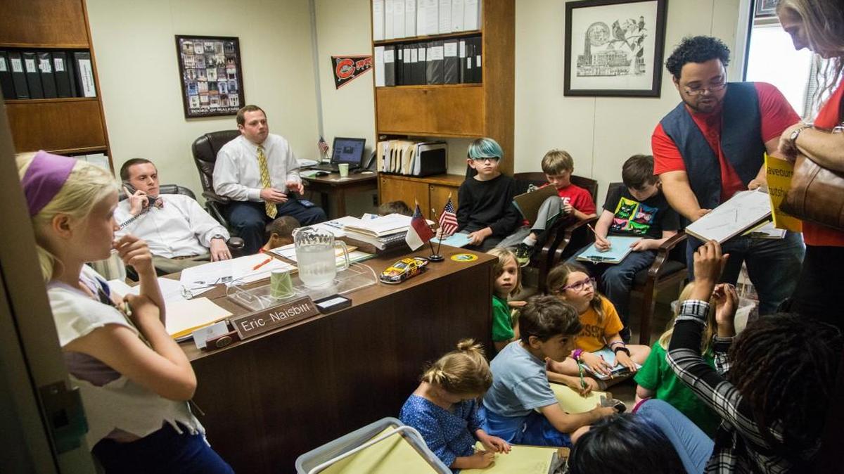 Durham elementary school students, teachers and parents hold an art lesson and protest inside Sen. Chad Barefoot’s office in the Legislative Office Building in Raleigh on May 3, 2017 to ask state lawmakers to increase education funding.