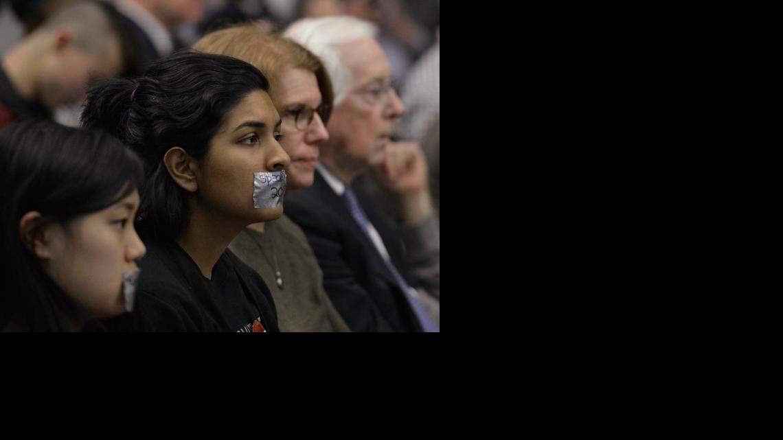 
Some audience members wore duct tape over their mouths during the UNC Board of Governors meeting Friday at UNC Charlotte.
