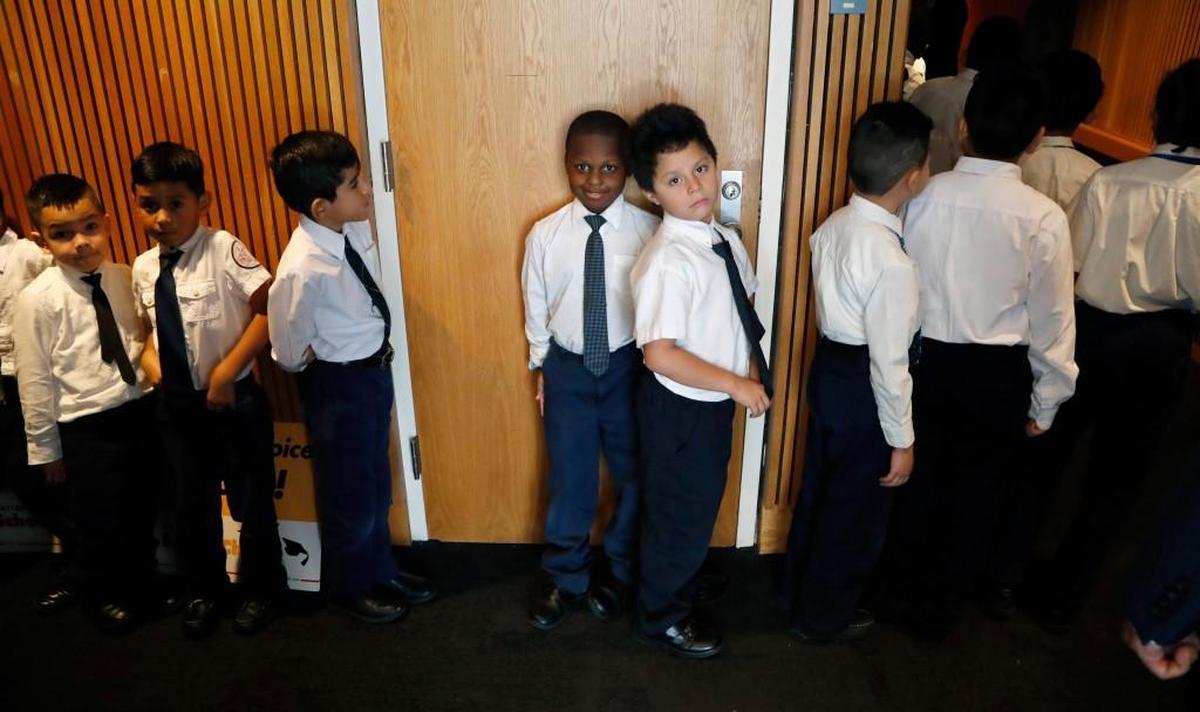 Students from Torchlight Academy in Raleigh wait in line before they take the stage. Hundreds came to a school choice rally held at the N.C. Museum of History on Jan. 23, 2018. State Superintendent of Public Instruction Mark Johnson was one of the featured speakers.