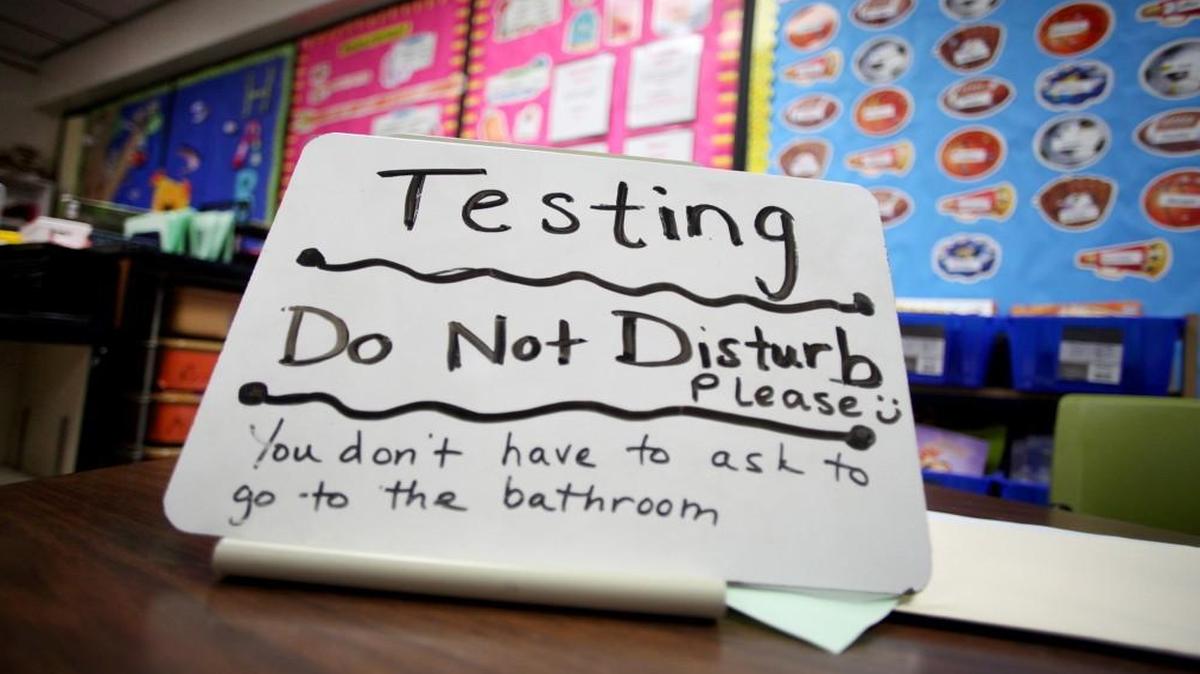 This sign sits on the desk of third grade teacher Sara Ancira on Tuesday, April 29, 2014, in Naperville, Illinois.