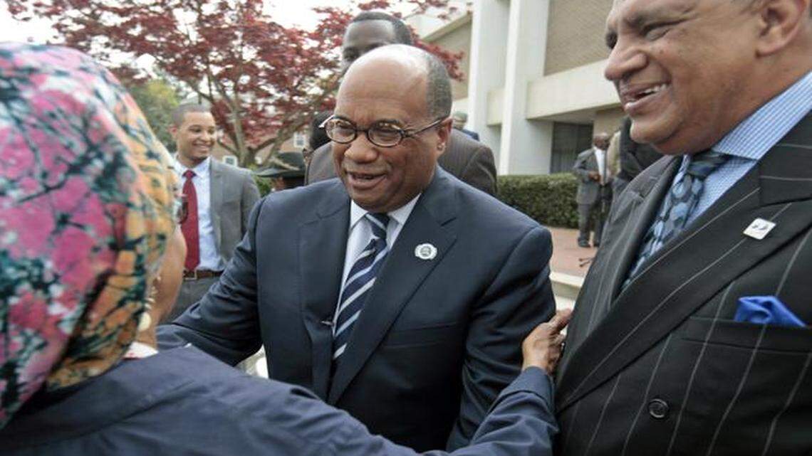
From left, a member of the St. Augustine's University family greets president Everett B. Ward, as Ward and St. Augustine's Board of Trustees member Rev. Hilton Smith walked among students and staff Friday, April 10, 2015 after Ward was named by a unanimous vote of the St. Augustine's Board of Trustees as the 11th president of St. Augustine's. A press announcement was held in front of the Prezell R. Robinson Library on the St. Aug's campus.
