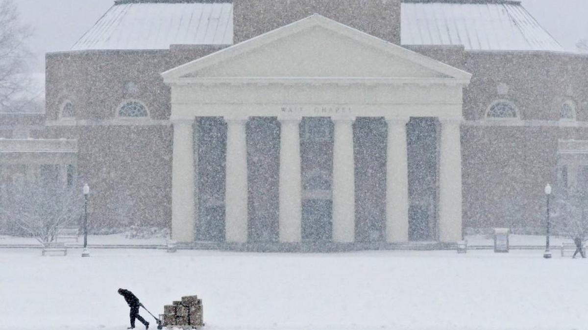Someone hauls a pallet across the snowy expanse of Hearn Plaza on the Wake Forest University campus in Winston-Salem, N.C., Wednesday, Jan. 17, 2018.