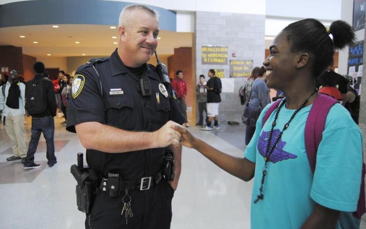 School resource officer Pete Smith uses a body-worn camera at Knightdale High School. He uses the camera if there is a fight or if he needs to interview students.