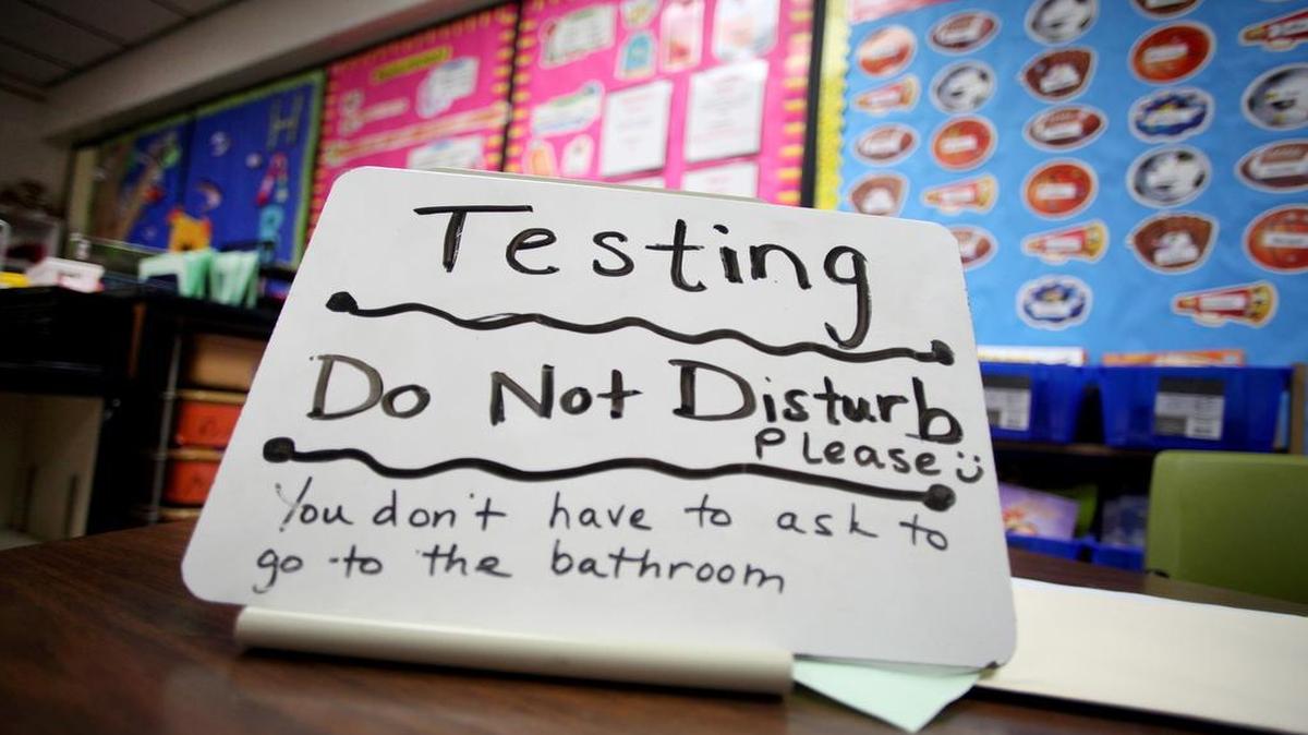 
This sign sits on the desk of third-grade teacher Sara Ancira during standardized testing in Naperville, Ill. The North Carolina Board of Education voted Thursday to try out a new system of shorter, more frequent standardized tests in the upcoming school year.
