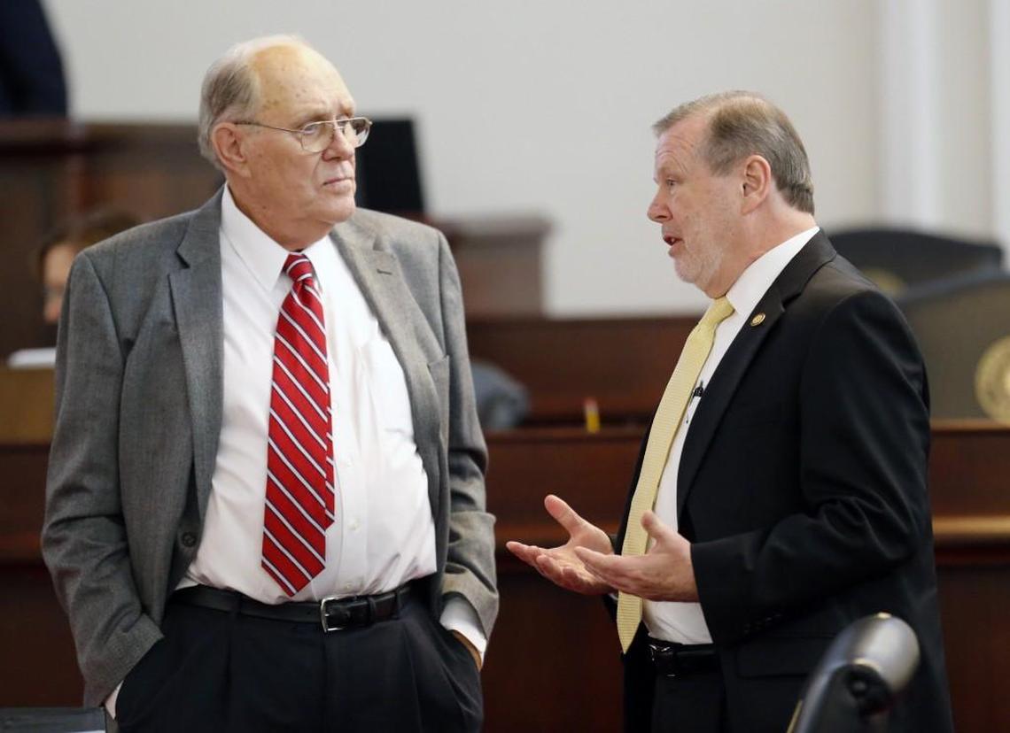 N.C. Sen. Jerry Tillman, majority whip, left, talks with Senate Pro-Tem Phil Berger on the Senate floor as the N.C. General Assembly convenes for a special session at the Legislative Building in Raleigh on Dec. 21, 2016.