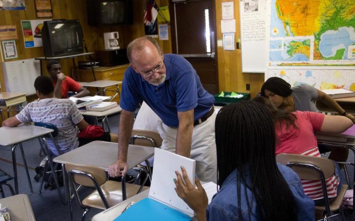 Joe Barley-Maloney teaches a 10th-grade American History II class on Aug. 4, 2014 at Southeast Raleigh High School. The Wake County school system will have to give dozens of state-developed exams in subjects such as American History II after state lawmakers took away the ability to get waivers from taking the N.C. Final Exams.