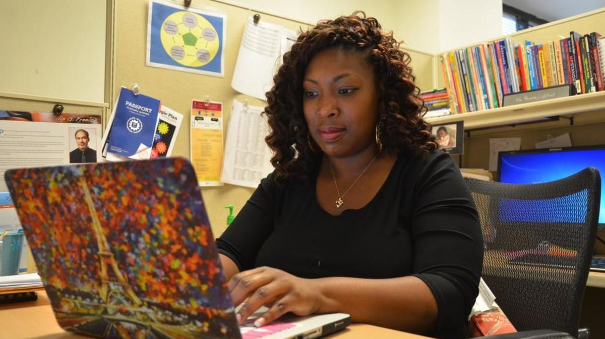 Shanta Lightfoot, senior administrator for middle school English language arts for Wake County schools, works in her office last June. Lightfoot was a teaching fellow at N.C. State University before graduating in 2008.