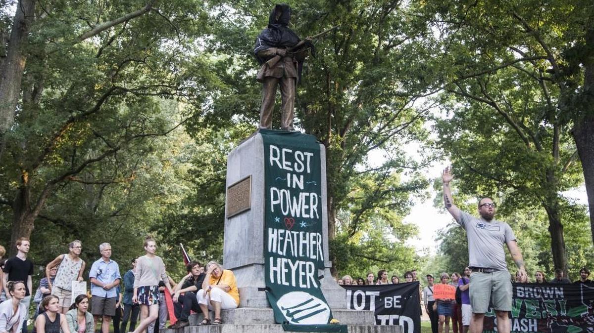 The Silent Sam statue, a memorial to Confederate soldiers, on the UNC-Chapel Hill campus was covered in black cloth as few hundred demonstrators gathered at the statue Sunday, August 13, 2017.