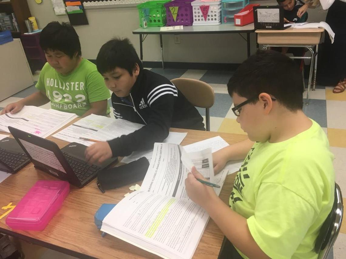 East Wake Middle sixth-graders Andre R’com, Danny Rmah Siu and Jacob Weimer work in a language arts class at the school near Knightdale, N.C., on Sept. 28. 2017.