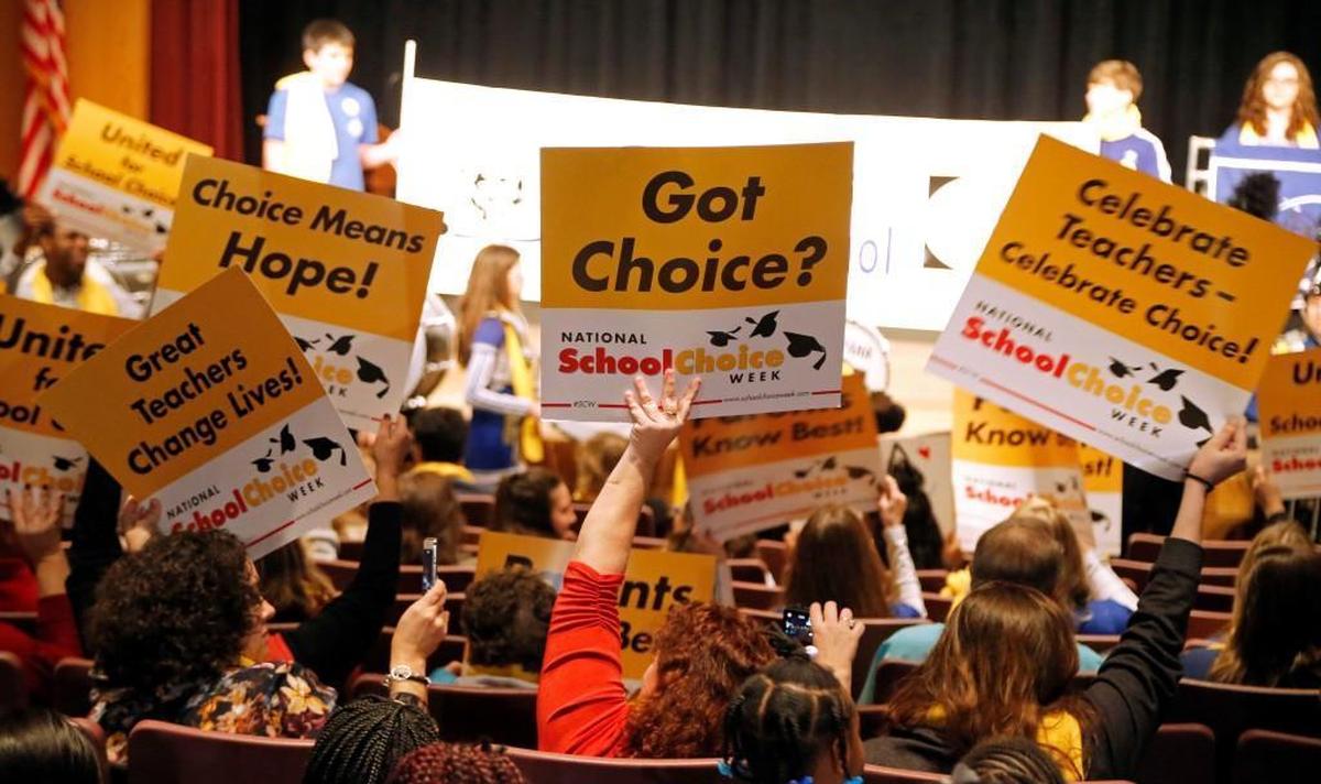 Supporters of expanding charter schools and private school vouchers hold a rally in Raleigh, N.C., in this 2018 file photo.