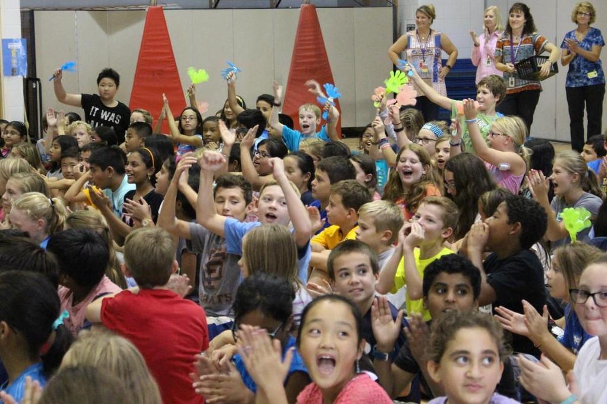 More than 200 fifth graders at Davis Drive Elementary School in Cary celebrate the announcement that their school has been named a 2016 National Blue Ribbon School on Sept. 28, 2016. 