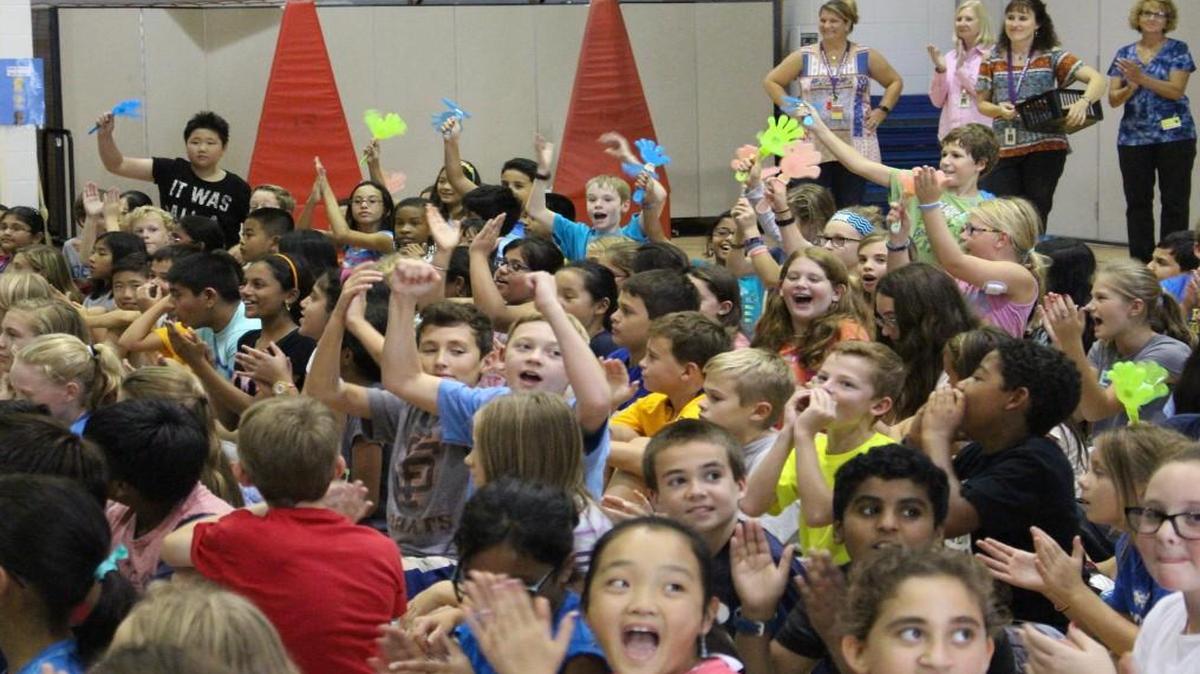 More than 200 fifth-graders at Davis Drive Elementary School in Cary celebrate the announcement that their school has been named a 2016 National Blue Ribbon School on Sept. 28, 2016. On Sept. 28, 2017, the adjoining Davis Drive Middle School was named a 2017 National Blue Ribbon School.