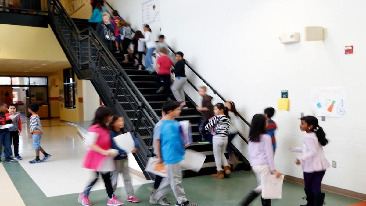 Students move between classes at Mills Park Elementary in Cary NC on Nov. 22, 2016. The Wake County student assignment staff says the school is overcrowded at 151 percent of its capacity. The new student assignment proposal calls for moving hundreds of students out of Mills Park, which families say is too drastic a change.