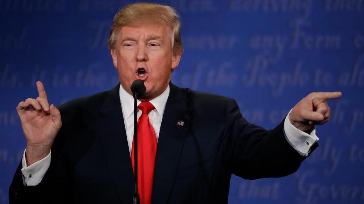 Republican presidential nominee Donald Trump speaks to Democratic presidential nominee Hillary Clinton during the third presidential debate at UNLV in Las Vegas, Wednesday, Oct. 19, 2016.
