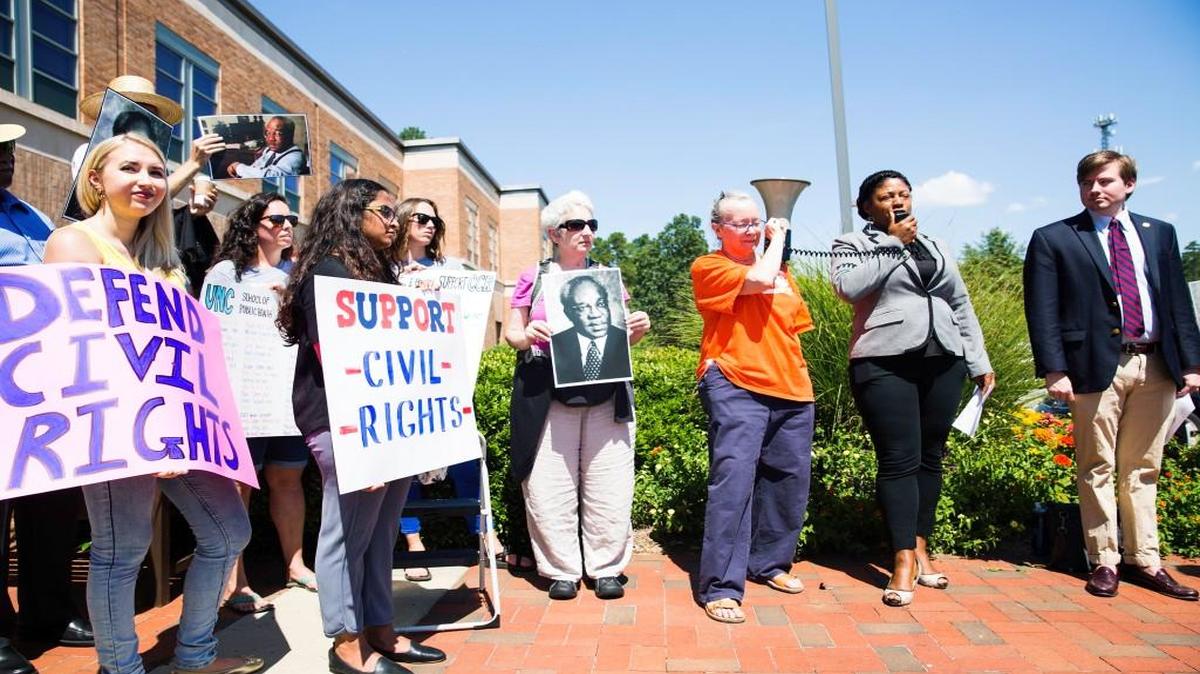 Protestors stand outside The Center for Leadership Development in support of the UNC Civil Rights Center before a committee debate determining the center's future on Aug. 1, 2017, in Chapel Hill, NC.