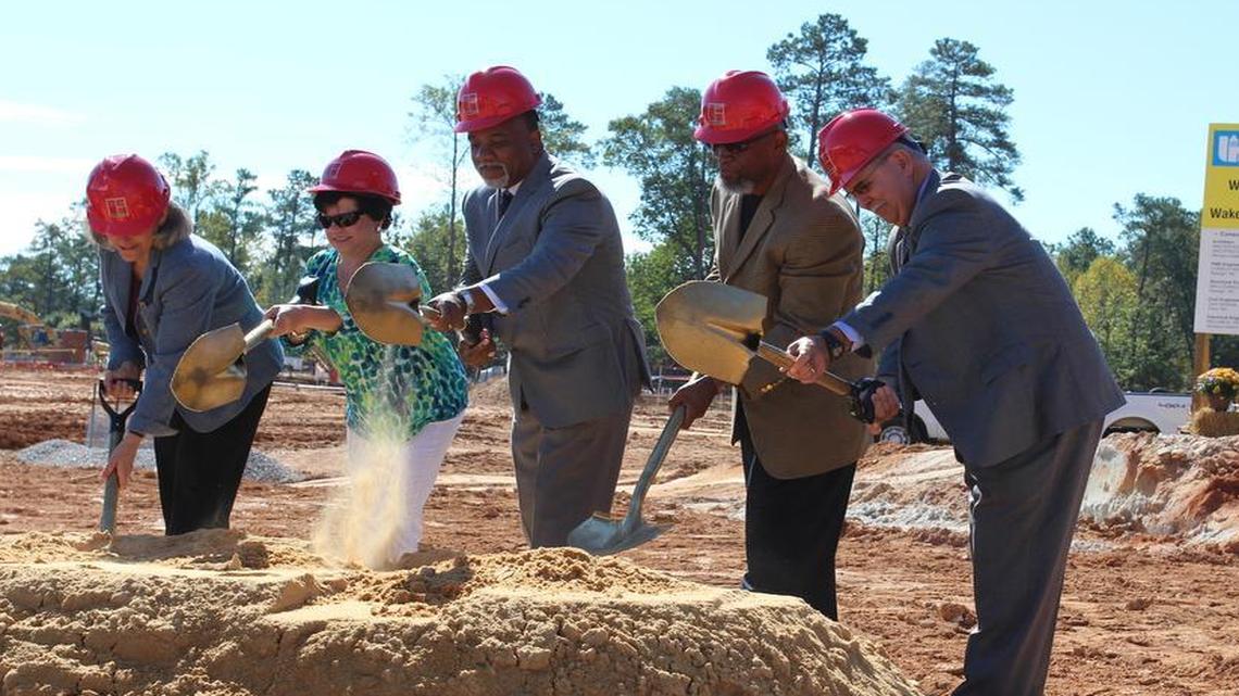 
From left, Wake County school board Chairwoman Christine Kushner, Forestville Road Elementary PTA president Candy Galke, architect Wesley Curtis, pastor Jasper Wilkins and Wake superintendent Jim Merrill turn dirt at the Beaverdam Elementary School site on Monday, Oct. 12, 2015. 

