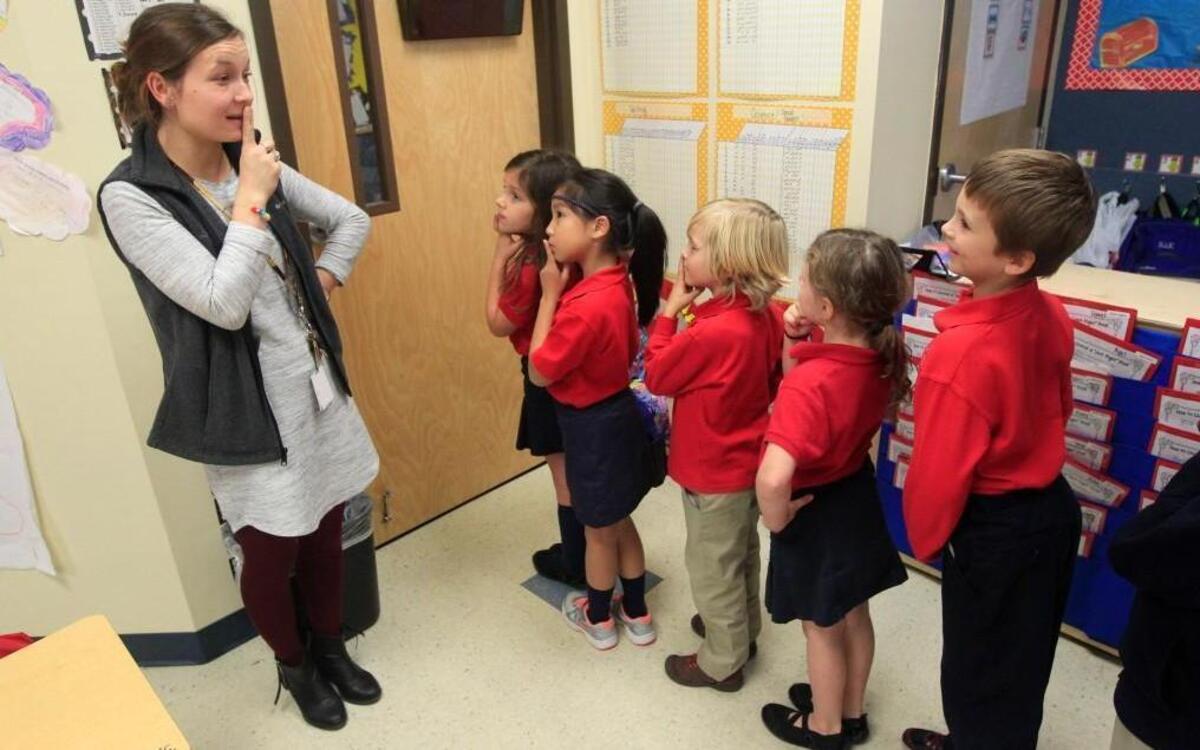 First-grade teacher Morgan Perry gets her class ready to head to lunch at Cardinal Charter Academy in Cary. Increasing competition from charter schools and home schools is causing the Wake County school system to scale back the number of new students it expects to receive during the next decade.