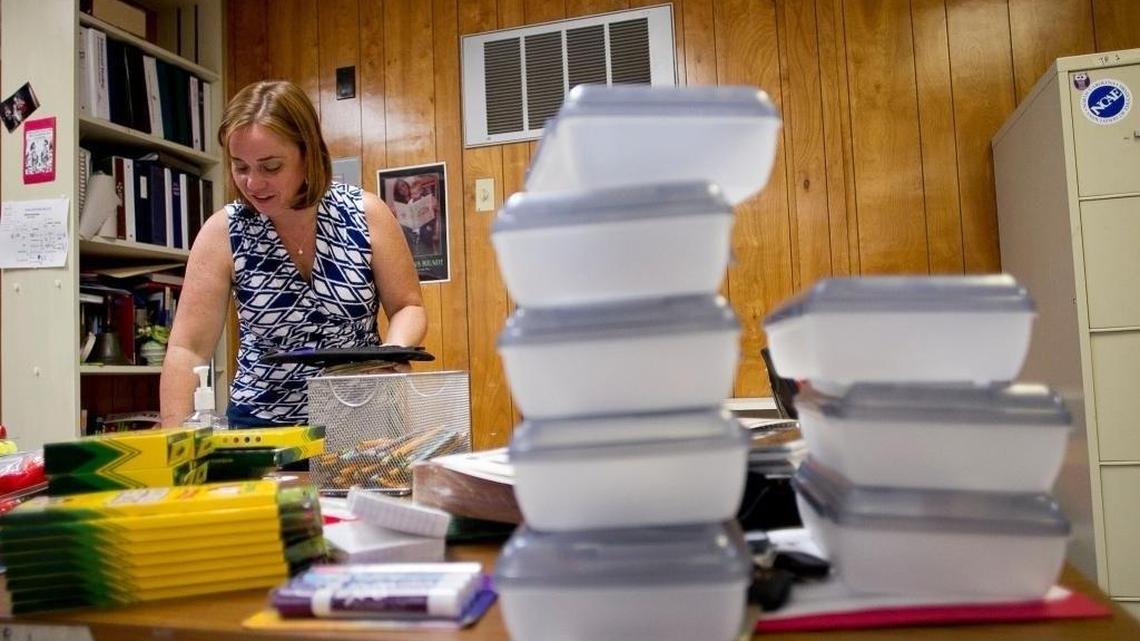 Sanderson High School teacher Jasmine Lauer works in her classroom on Aug. 11, 2016, in Raleigh. Lauer, an English teacher, spends up to $200 per semester on school supplies.