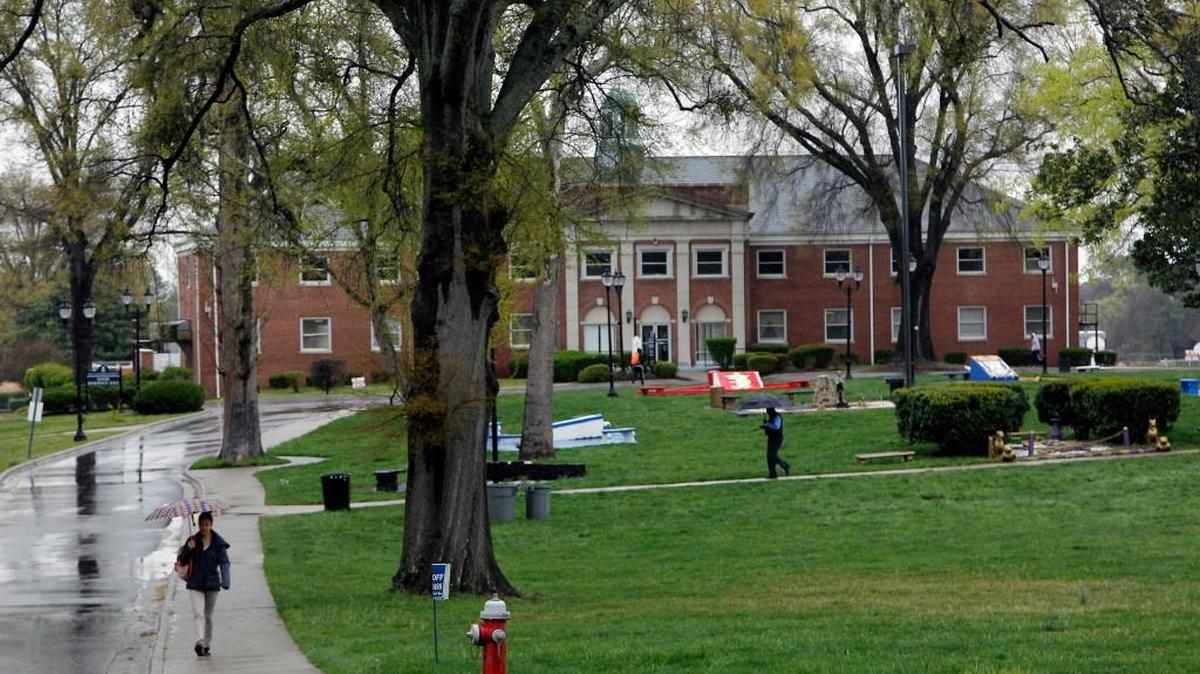People walk across the main courtyard on campus at St. Augustine’s University. St. Augustine’s University will remain on probation for another year, its accrediting agency decided Tuesday.