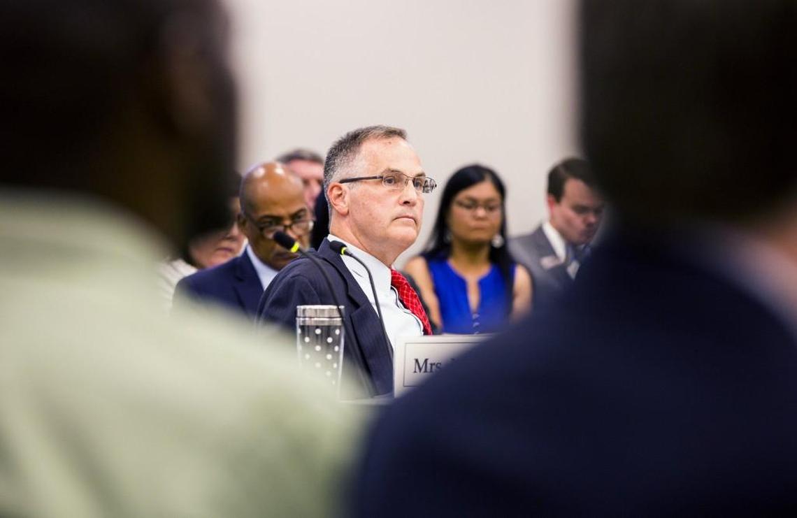 Steve Long listens to fellow members of the UNC Board of Governors debate about his proposal to ban the UNC Center for Civil Rights from litigating, at the Center for School Leadership Development on Tuesday, Aug. 1, 2017, in Chapel Hill.