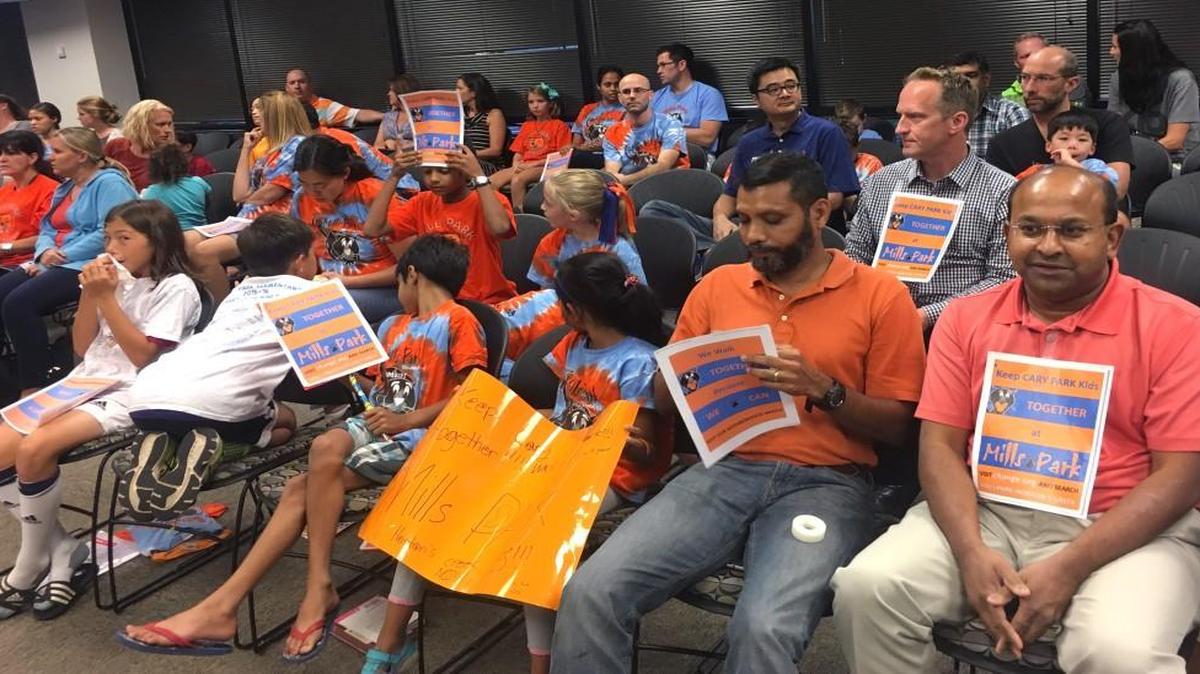 Cary Park families attend the Oct. 4, 2016 Wake County school board meeting to ask that students not be moved from Mills Park Elementary School to the new Hortons Creek Elementary School.